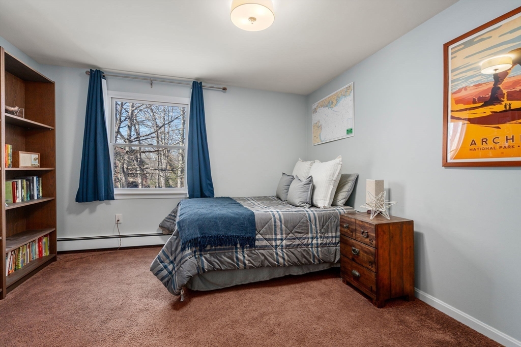 88 Robinwood Avenue Needham, MA 02492 - Photo 18 of 29 a bedroom with furniture and a book shelf