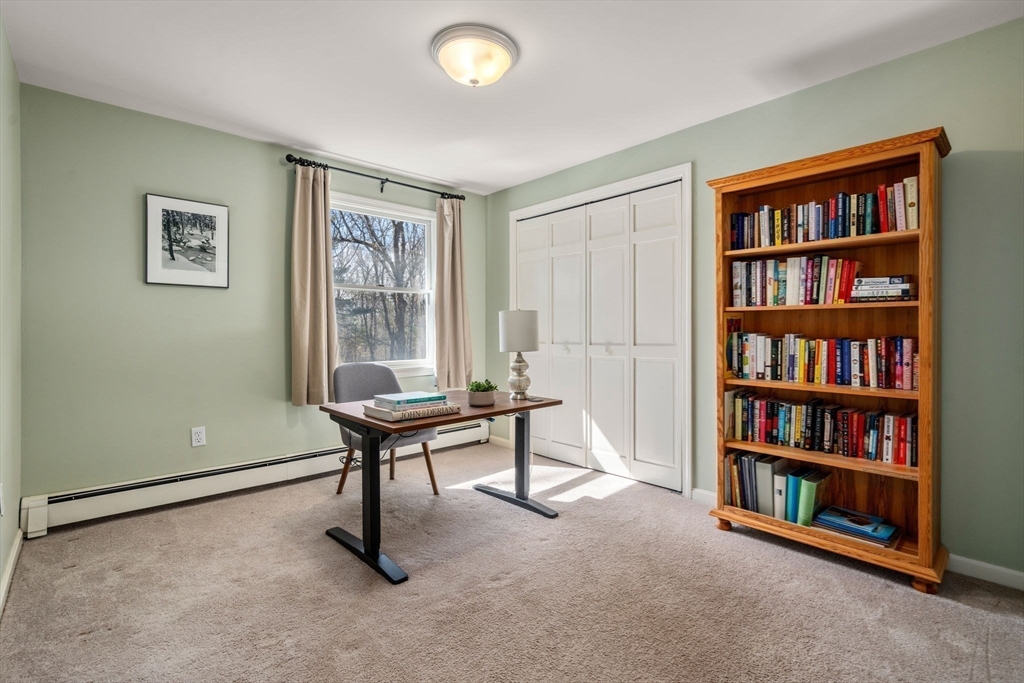 88 Robinwood Avenue Needham, MA 02492 - Photo 21 of 29 a living room with furniture and a book shelf