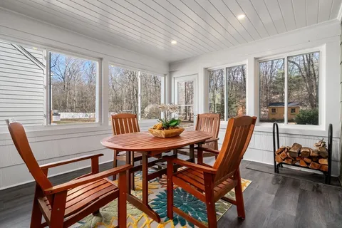 a view of a dining room with furniture window and outside view