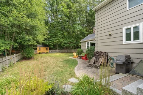 a view of a backyard with a patio
