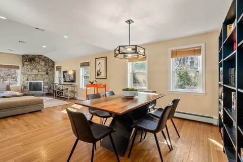 a view of a dining room with furniture window and wooden floor