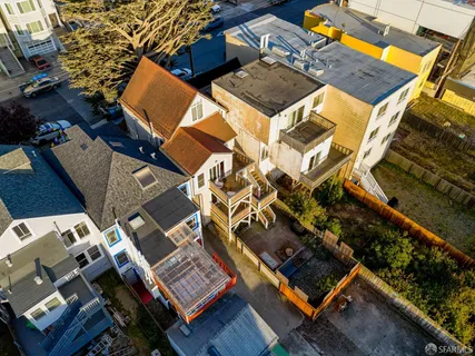an aerial view of a house with a garden
