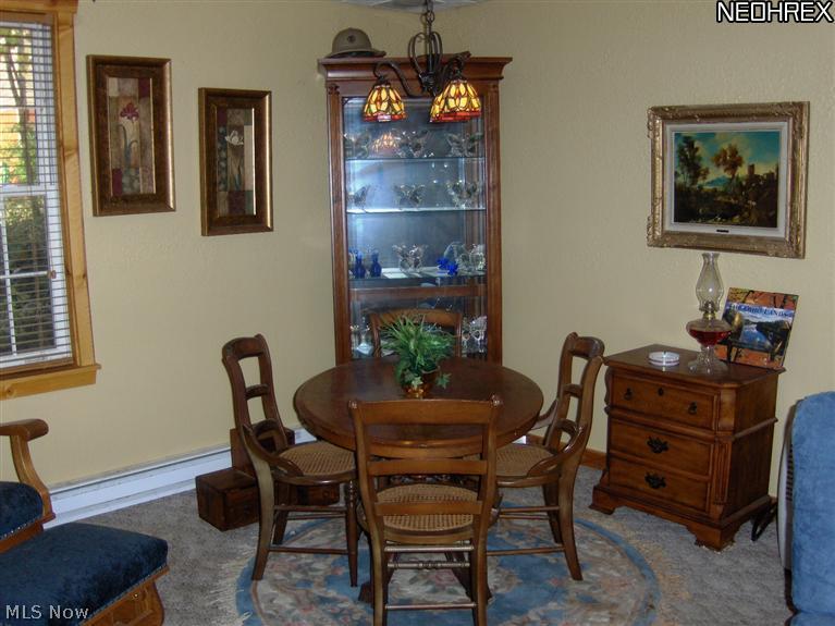 2040 Scroll Road Southwest Carrollton, OH 44615 - Photo 7 of 25 COZY AREA IN THE LOWER LEVEL FOR A GAME OF CARDS!