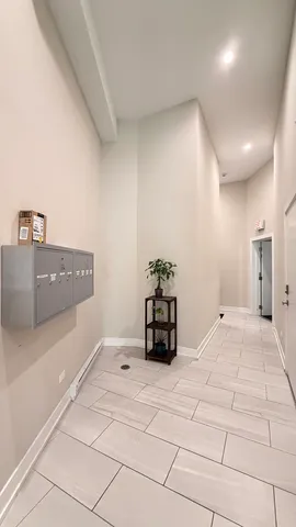 a bedroom with a bed and a potted plant