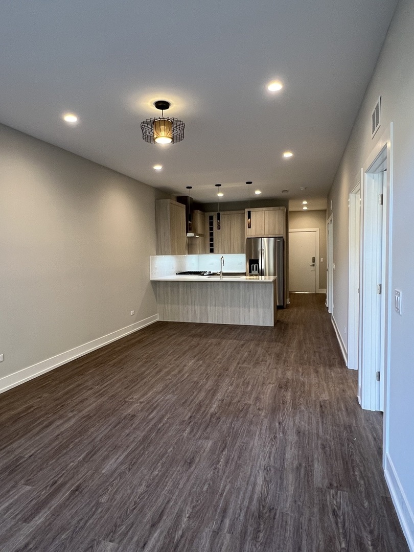 3244 North Lincoln Avenue, Unit 4 Chicago, IL 60657 - Photo 9 of 14 a view of kitchen and kitchen with wooden floor