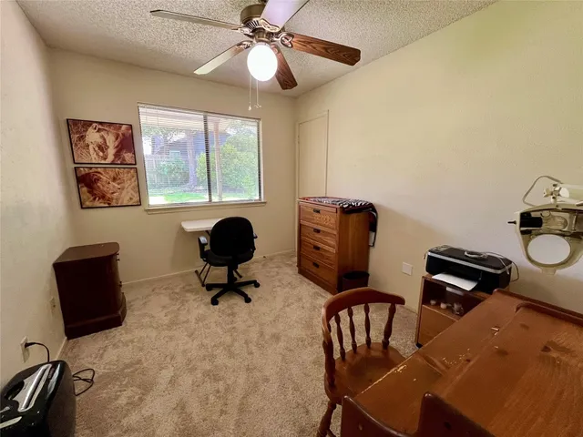 a view of a workspace with furniture