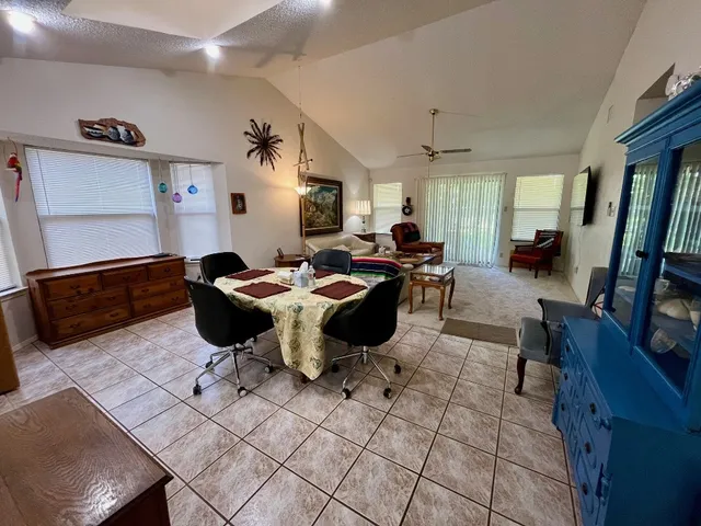 a living room with lots of furniture and a flat screen tv