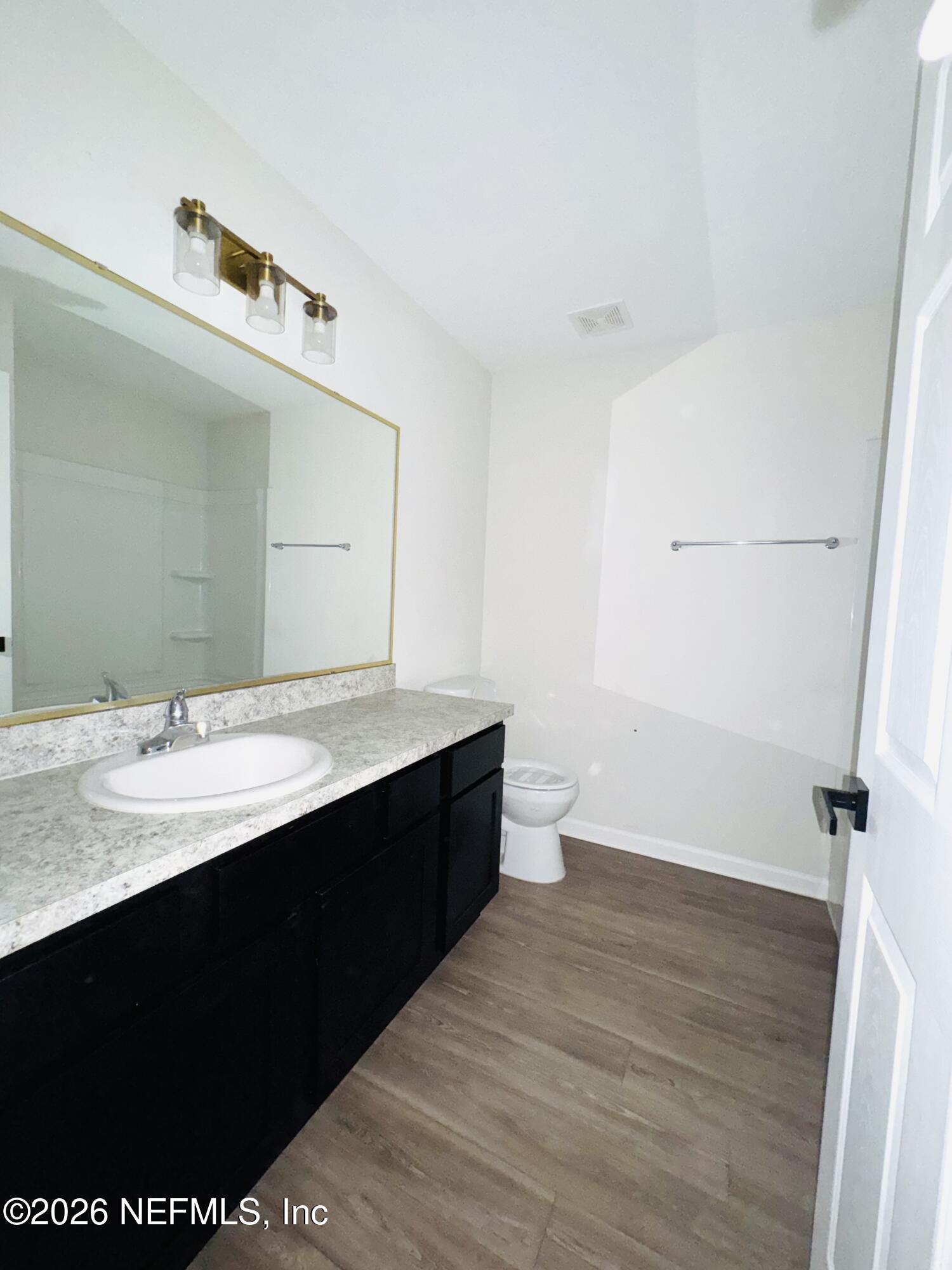3501 Stillman Street Jacksonville, FL 32207 - Photo 13 of 17 a bathroom with a sink and a mirror