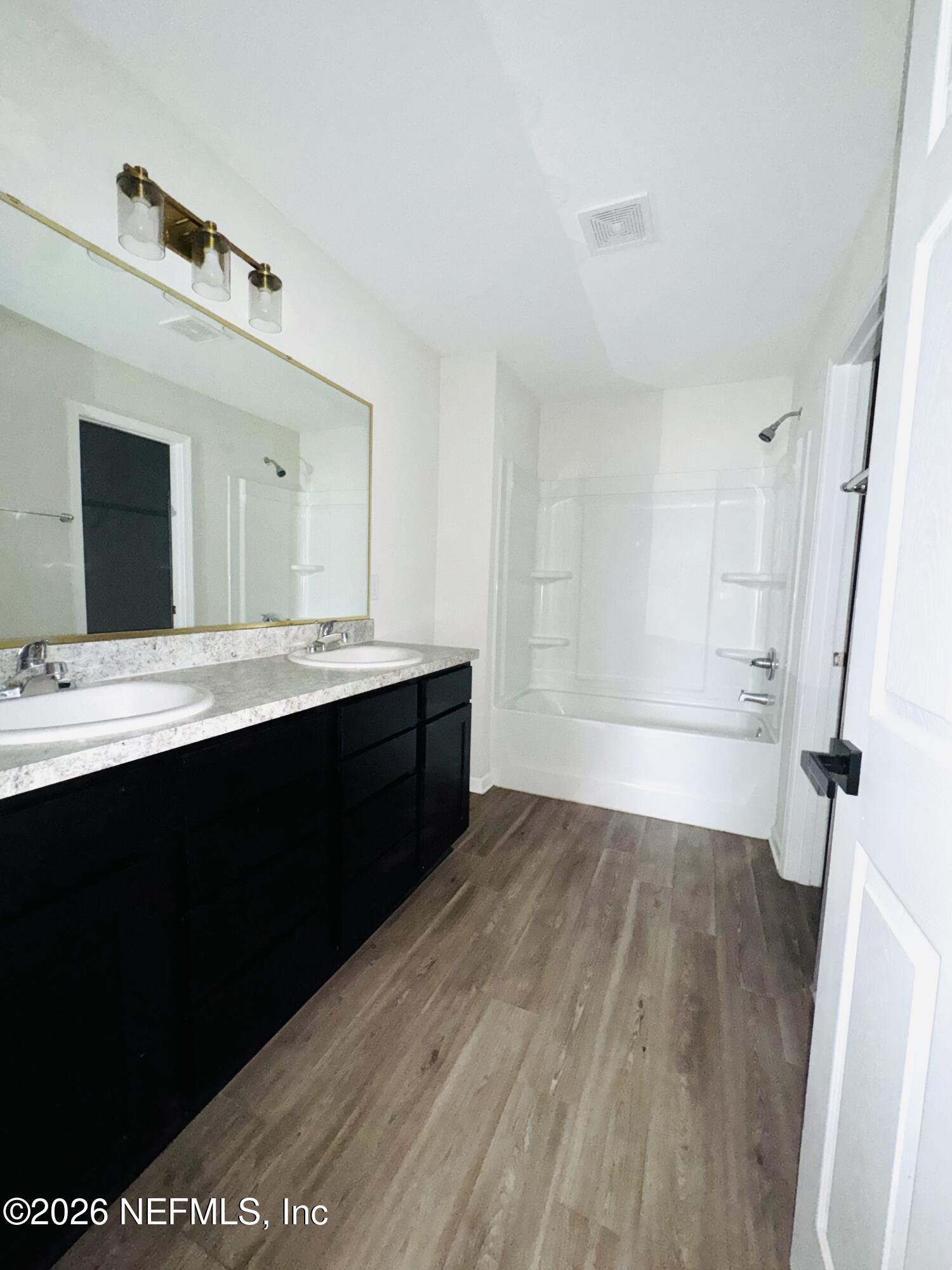 3501 Stillman Street Jacksonville, FL 32207 - Photo 16 of 17 a bathroom with a sink and a mirror