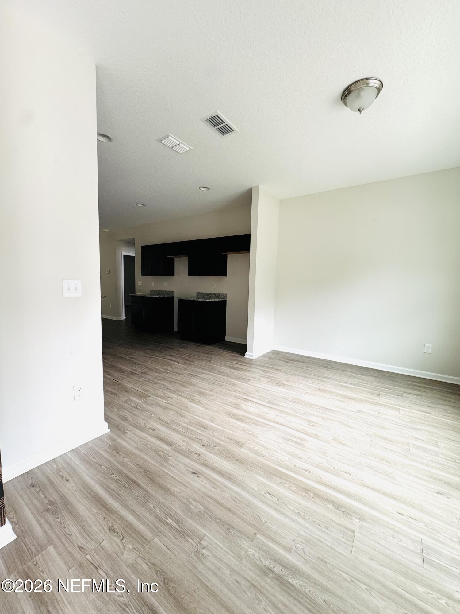 3501 Stillman Street Jacksonville, FL 32207 - Photo 3 of 17 a view of an empty room with wooden floor