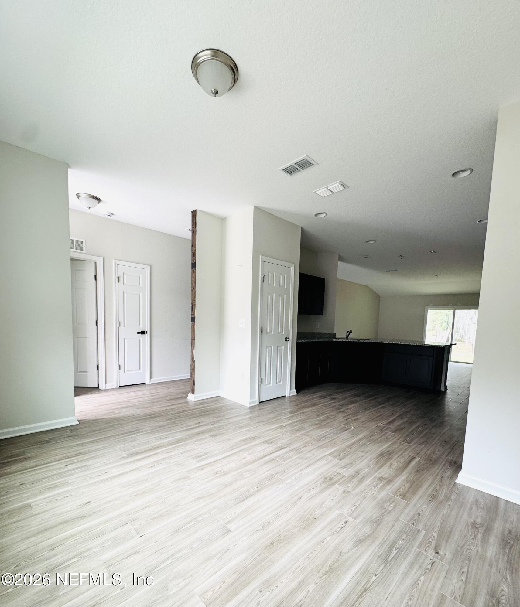 3501 Stillman Street Jacksonville, FL 32207 - Photo 4 of 17 a view of an empty room with wooden floor
