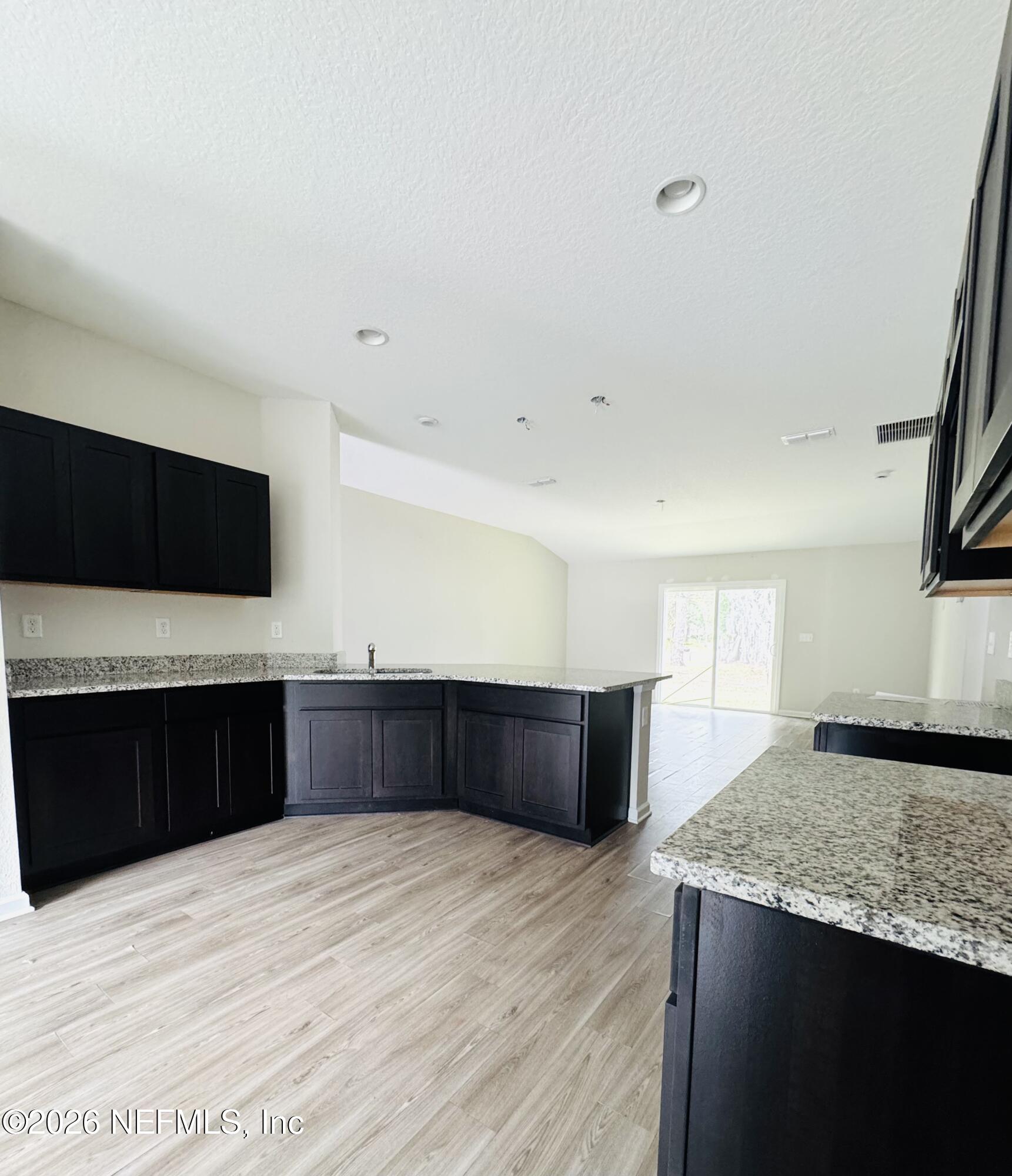 3501 Stillman Street Jacksonville, FL 32207 - Photo 6 of 17 a kitchen with stainless steel appliances kitchen island sink refrigerator and stove