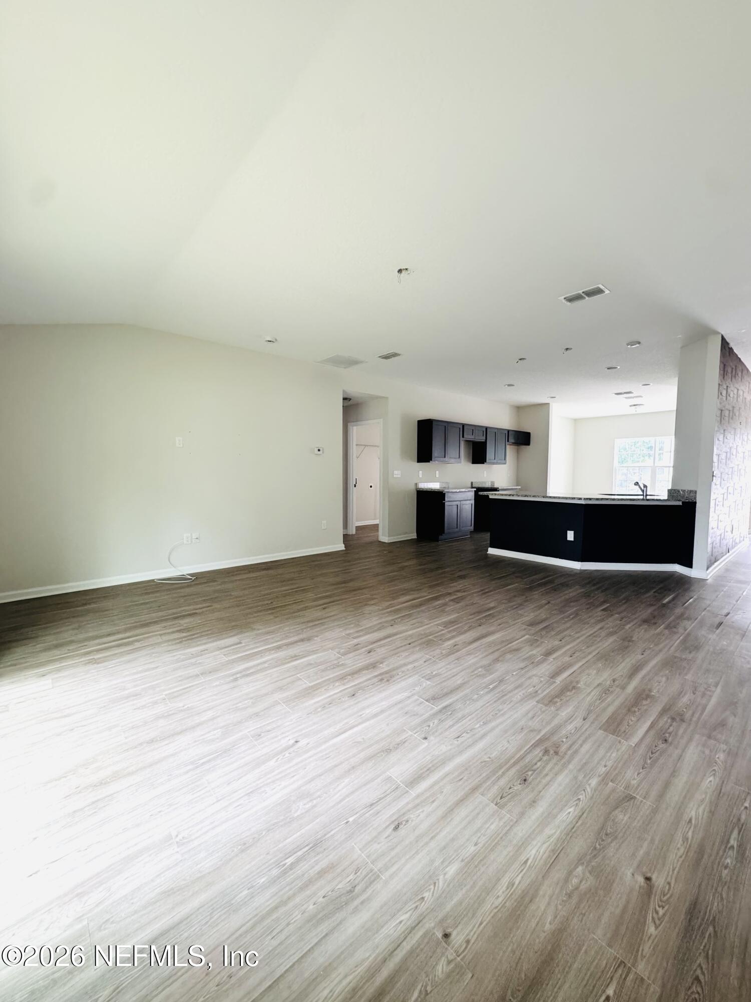 3501 Stillman Street Jacksonville, FL 32207 - Photo 8 of 17 a view of kitchen and wooden floor