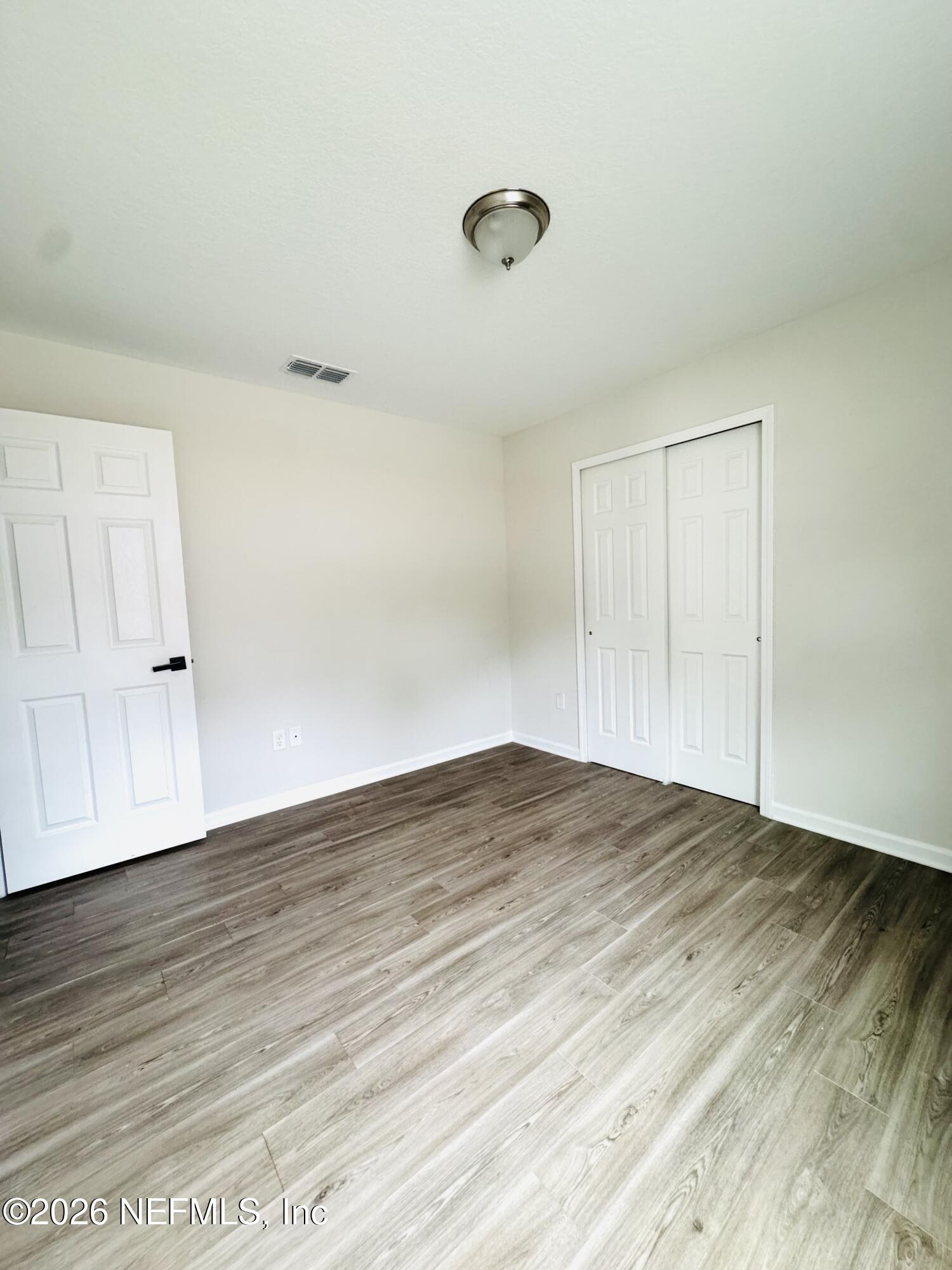 3501 Stillman Street Jacksonville, FL 32207 - Photo 9 of 17 a view of empty room with wooden floor