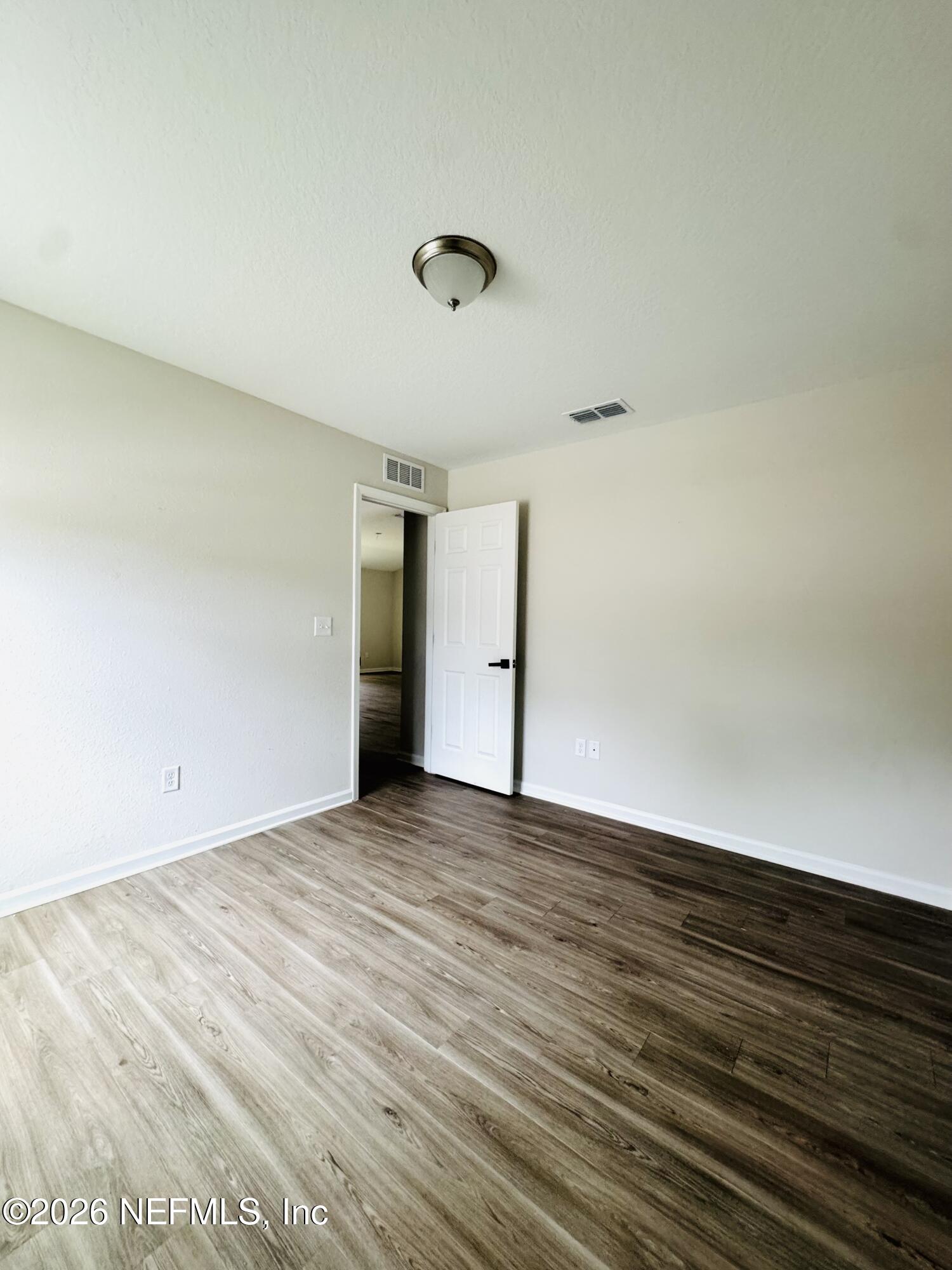 3501 Stillman Street Jacksonville, FL 32207 - Photo 10 of 17 a view of an empty room with wooden floor