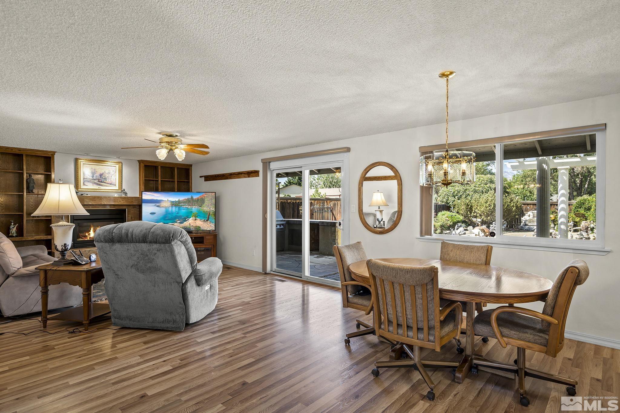 14335 Riata Circle Reno, NV 89521 - Photo 8 of 34 a living room with furniture and a large window
