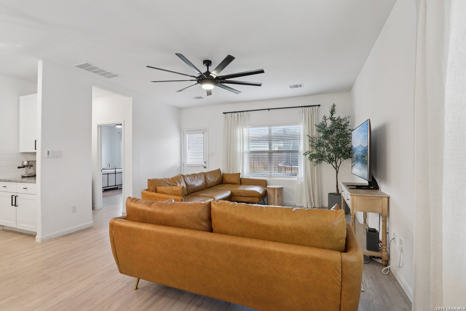 9062 Austin Seguin, TX 78155 - Photo 11 of 43 a living room with furniture and a flat screen tv