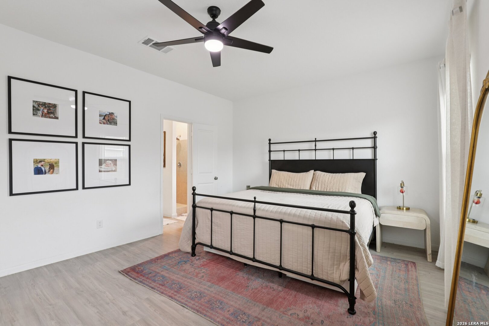 9062 Austin Seguin, TX 78155 - Photo 18 of 43 a bedroom with a bed and a ceiling fan