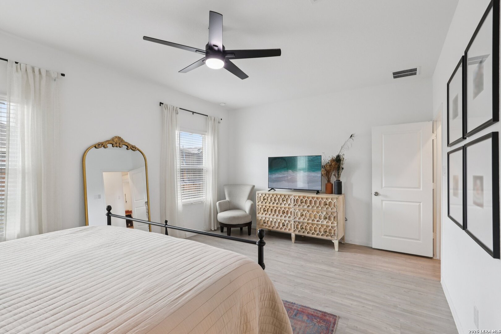 9062 Austin Seguin, TX 78155 - Photo 19 of 43 a bedroom with a bed and wooden floor