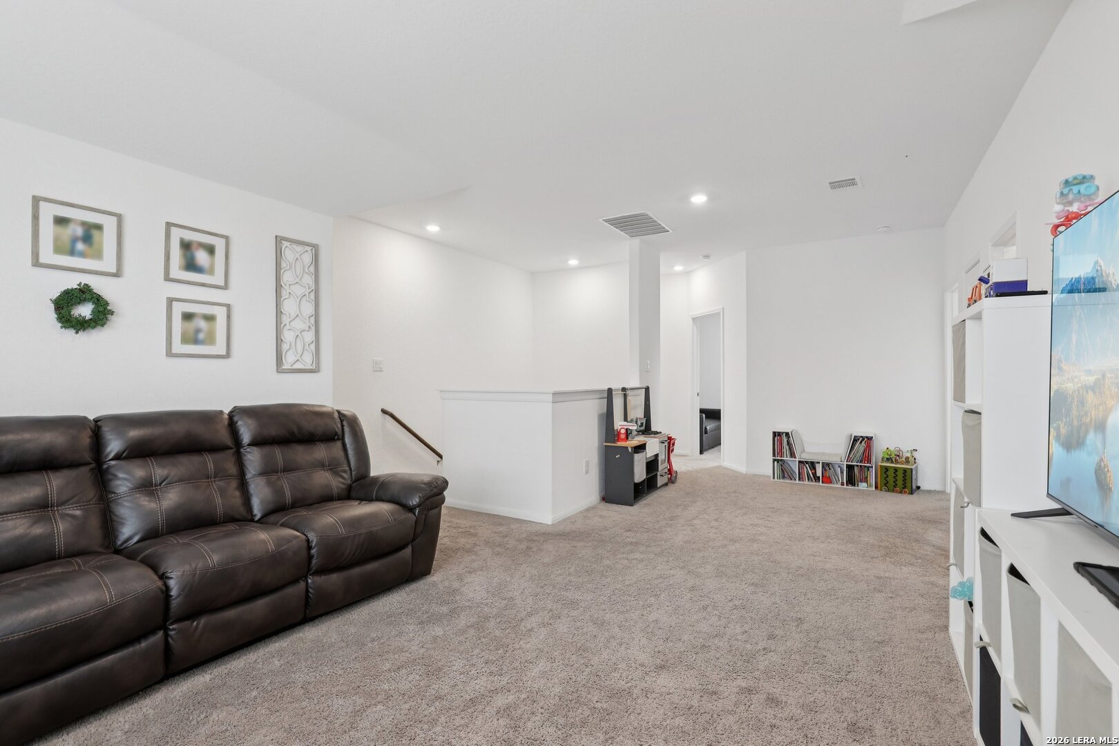 9062 Austin Seguin, TX 78155 - Photo 22 of 43 a living room with furniture and a flat screen tv