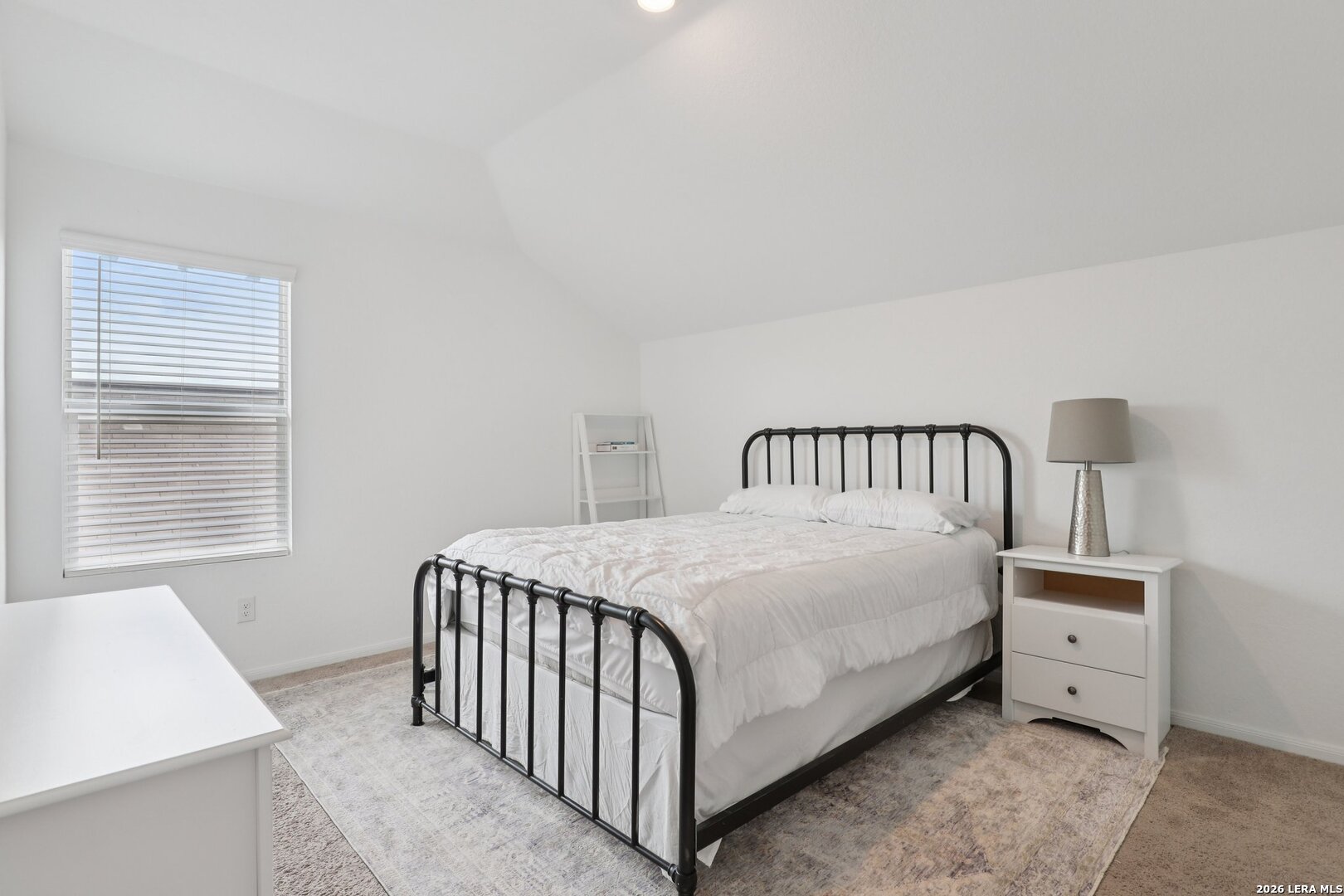 9062 Austin Seguin, TX 78155 - Photo 23 of 43 a bedroom with a bed and a window