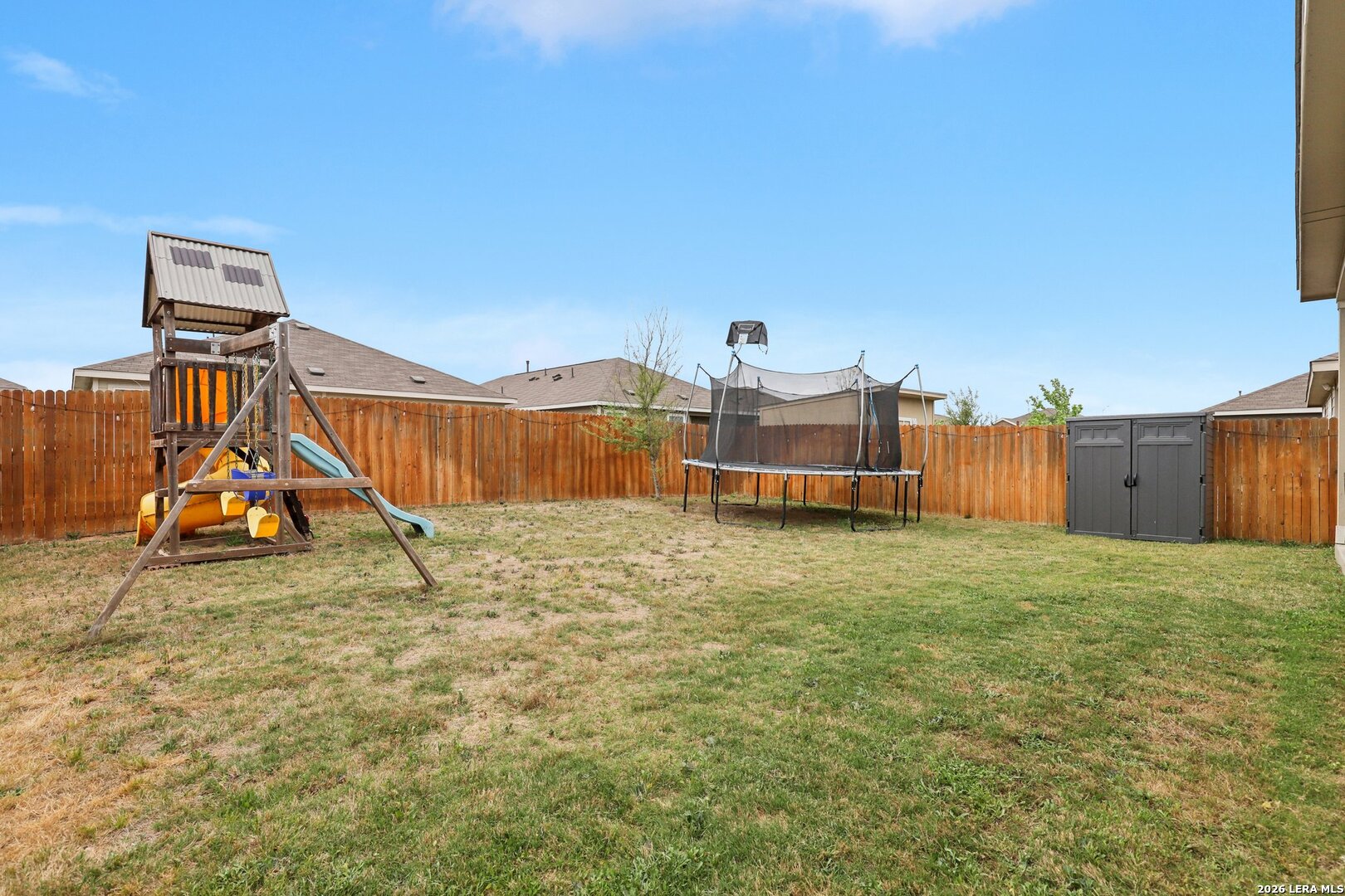9062 Austin Seguin, TX 78155 - Photo 30 of 43 a view of a house with backyard and a slide