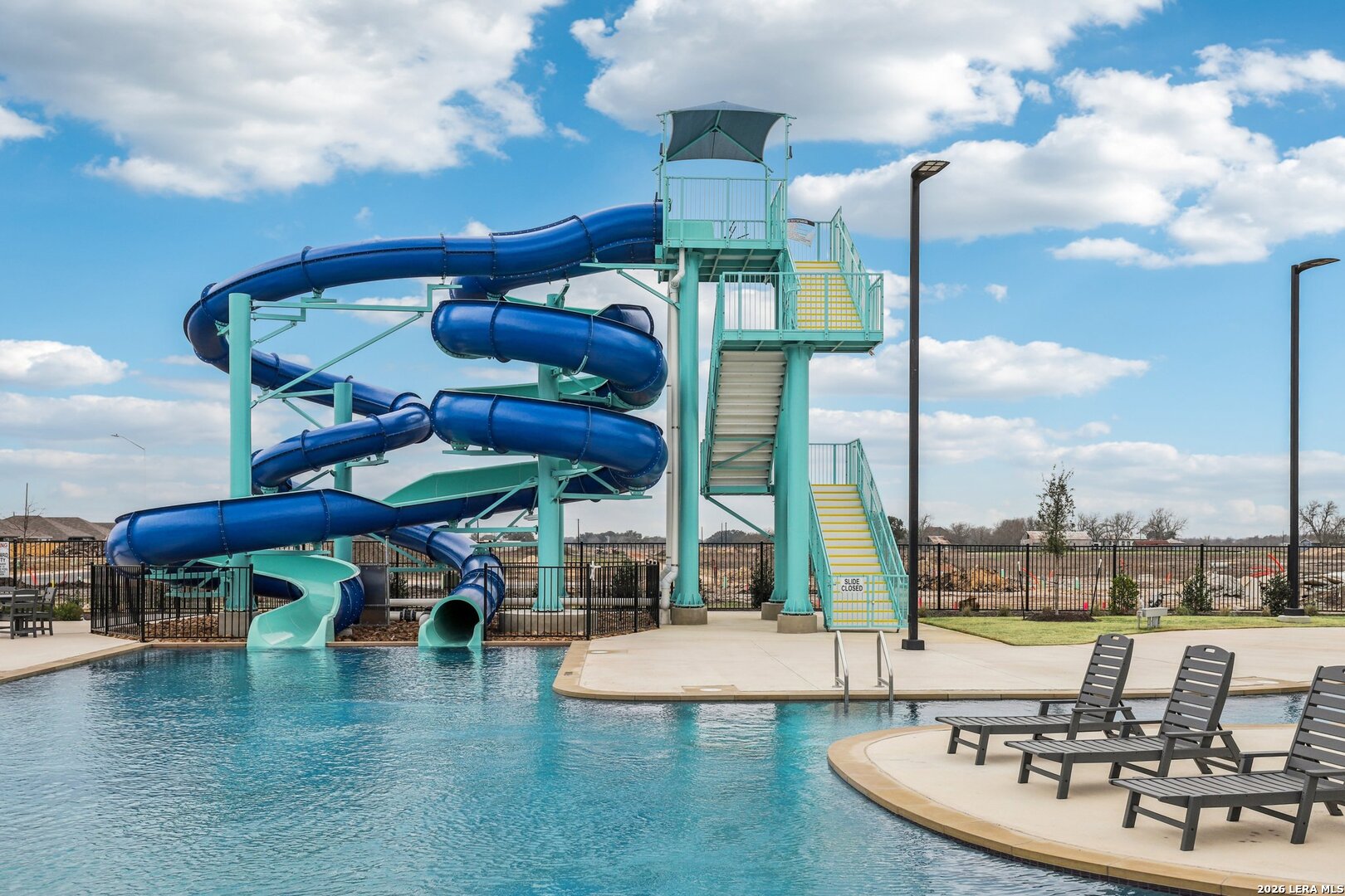 9062 Austin Seguin, TX 78155 - Photo 38 of 43 a view of a swimming pool with a table and chairs