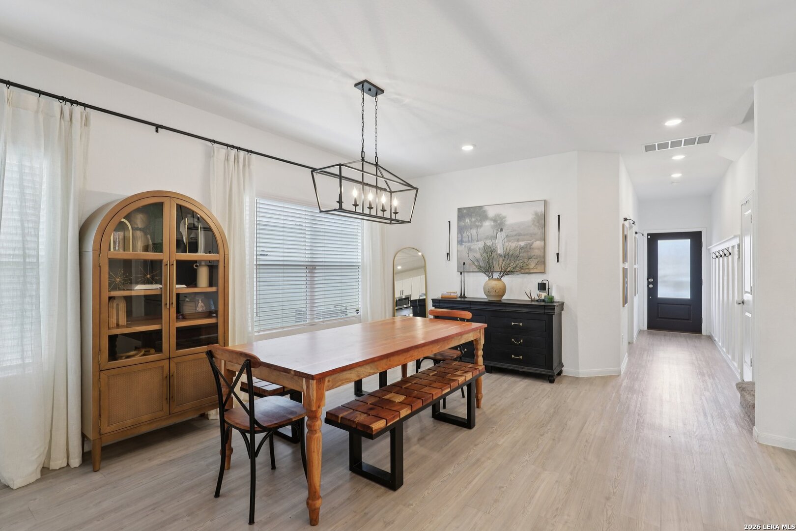 9062 Austin Seguin, TX 78155 - Photo 4 of 43 a dining room with furniture a rug and wooden floor