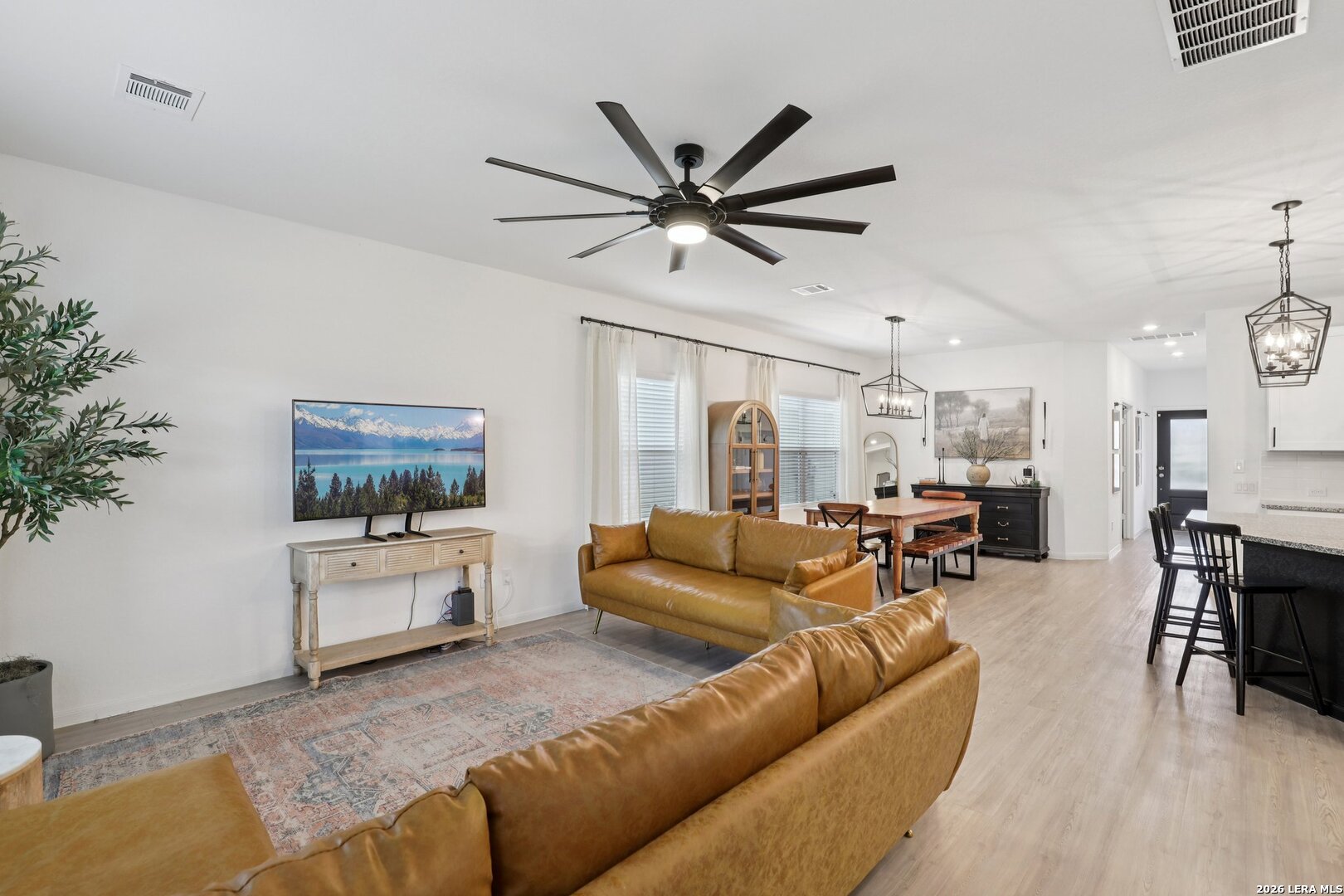 9062 Austin Seguin, TX 78155 - Photo 8 of 43 a living room with furniture and a flat screen tv