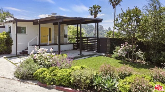 a view of a house with a garden