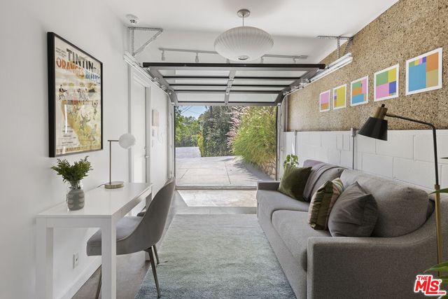 a spacious bedroom with a large bed and a large window