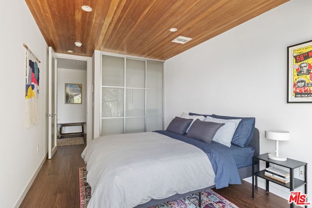 a view of a house with backyard sitting area and garden