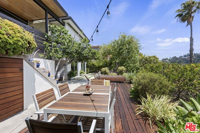 a sign that is in front of flowers