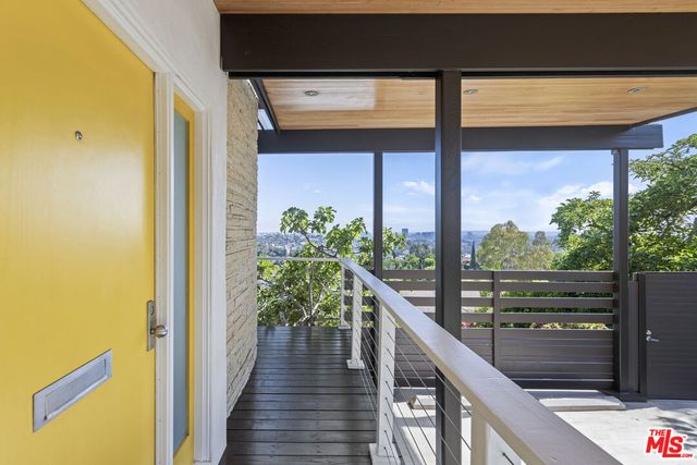 a view of a living room and floor to ceiling window