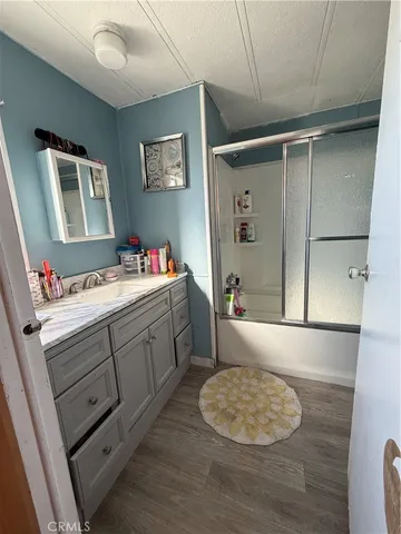 a bedroom with a bed and mirror