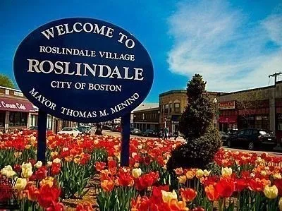 a view of a pathway of a building with a tree