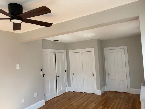 a white toilet sitting next to a bathroom sink