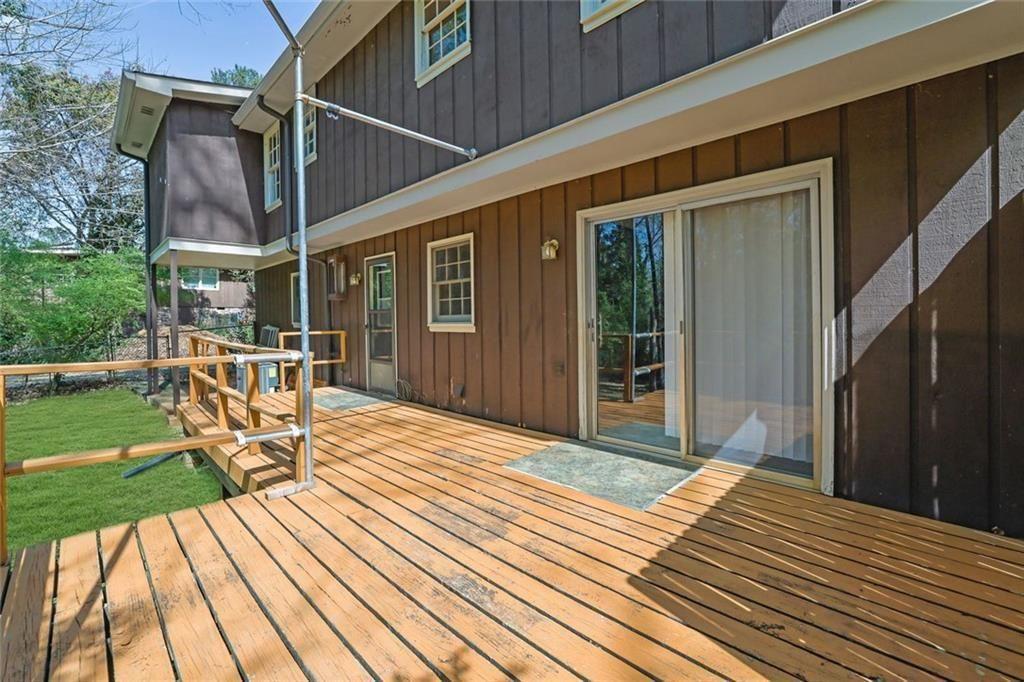 4341 Five Forks Trickum Road Southwest Lilburn, GA 30047 - Photo 27 of 35 a balcony view with a seating space