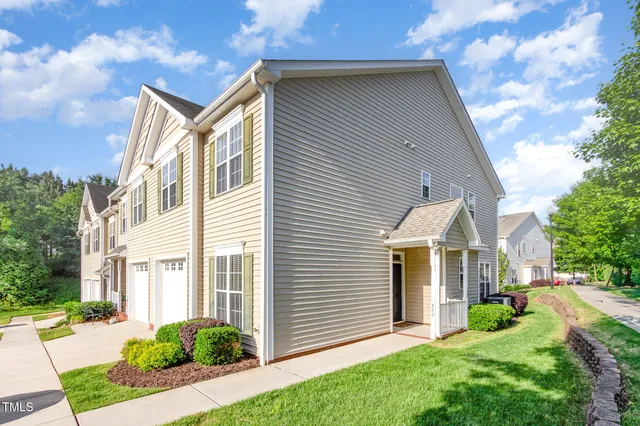 a picture of a book and a white bed