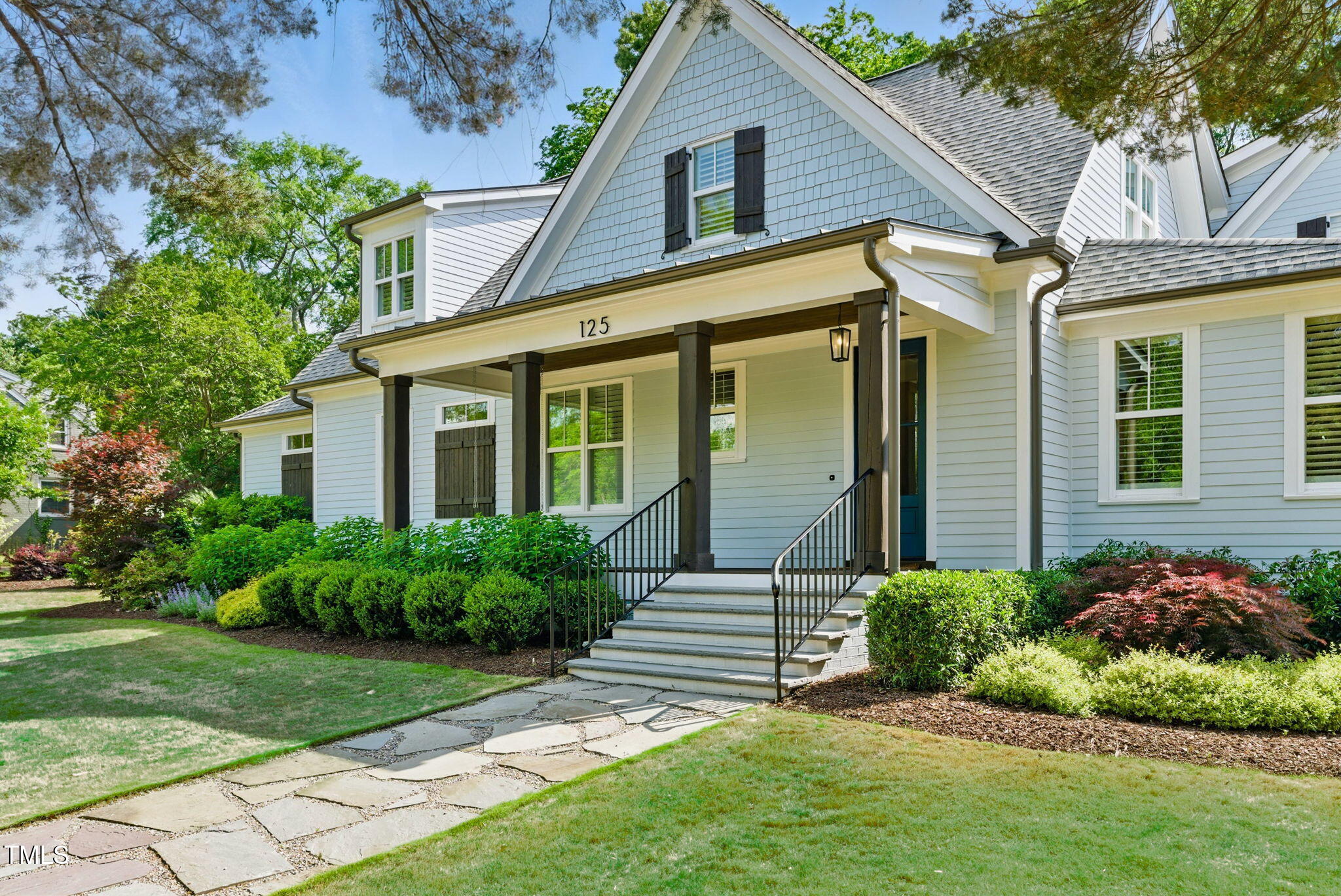125 Lord Ashley Road Raleigh, NC 27610 - Photo 13 of 85 a front view of a house with a garden