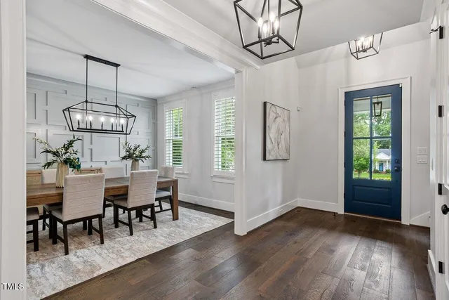 a view of a livingroom with a ceiling fan and window