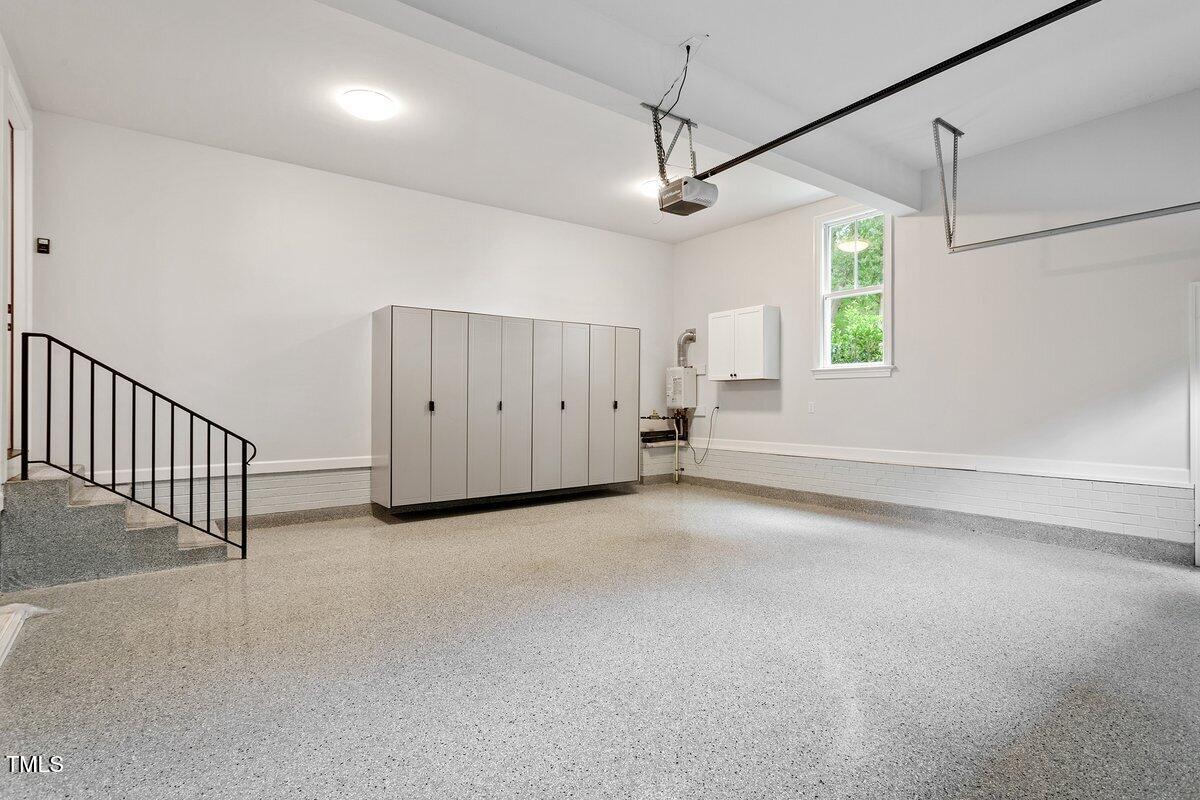 125 Lord Ashley Road Raleigh, NC 27610 - Photo 62 of 85 an empty room with a ceiling fan and windows