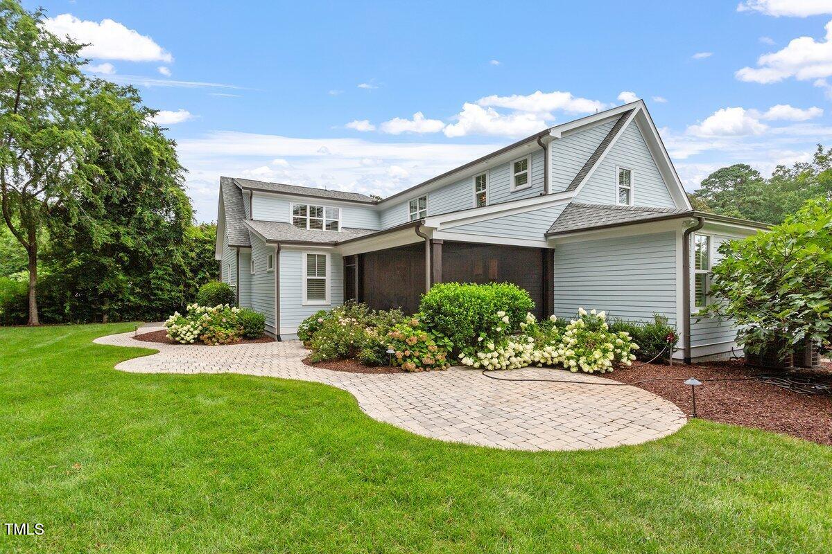 125 Lord Ashley Road Raleigh, NC 27610 - Photo 64 of 85 a front view of a house with a yard and garage