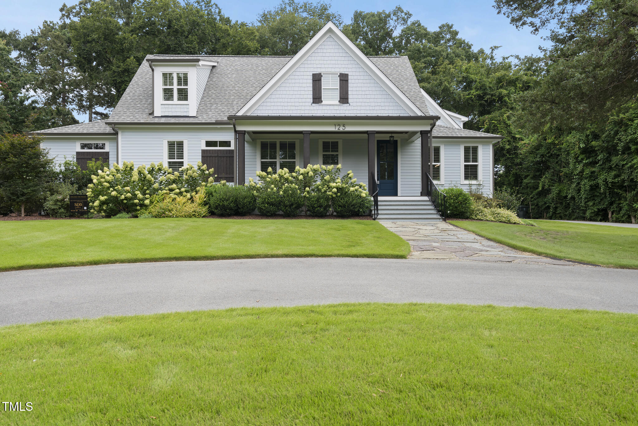 125 Lord Ashley Road Raleigh, NC 27610 - Photo 9 of 85 a front view of a house with a yard and garage