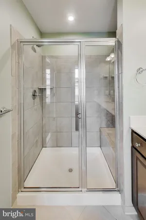 a bathroom with a glass shower door