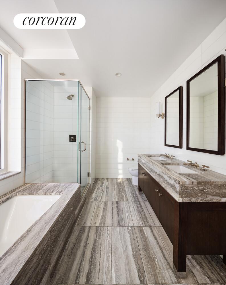 80 Riverside Boulevard, Unit 36B Manhattan, NY 10069 - Photo 12 of 25 a bathroom with a granite countertop sink and a large mirror