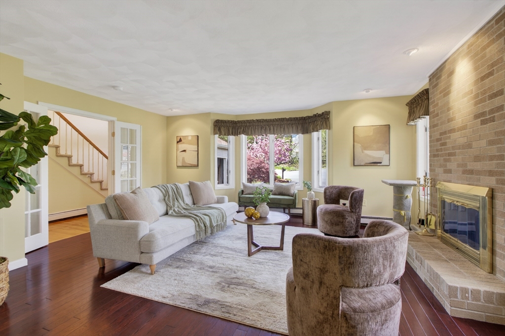 43 Hampshire Road Peabody, MA 01960 - Photo 13 of 42 a living room with furniture and a fireplace