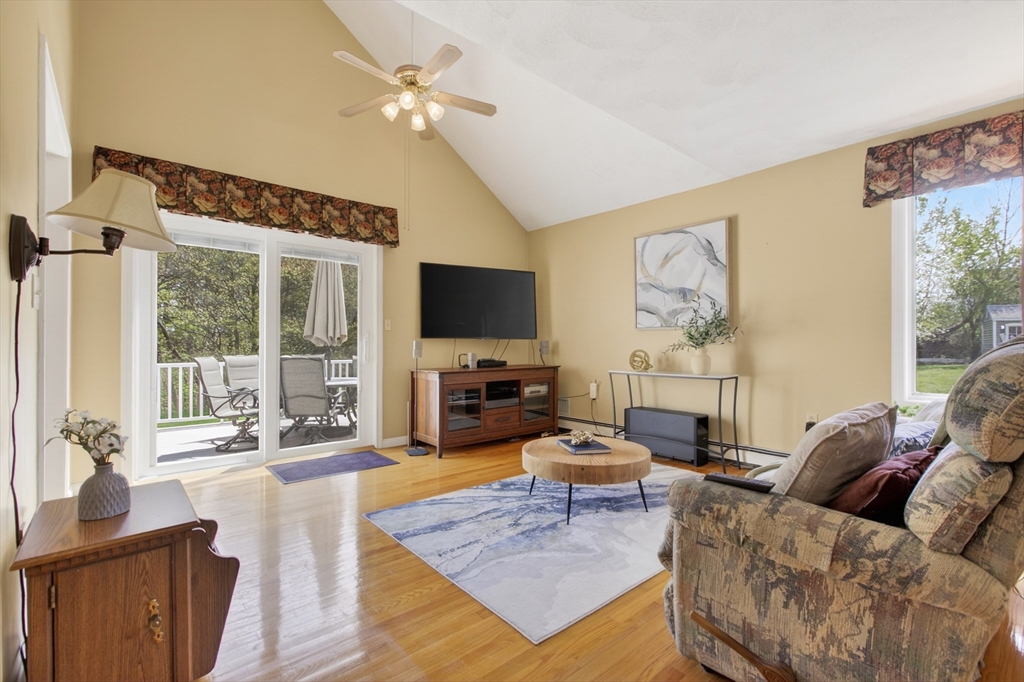 43 Hampshire Road Peabody, MA 01960 - Photo 19 of 42 a living room with furniture a large window and a flat screen tv