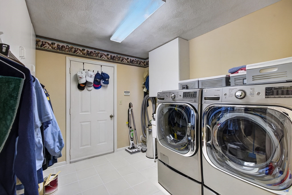 43 Hampshire Road Peabody, MA 01960 - Photo 22 of 42 a utility room with dryer and washer