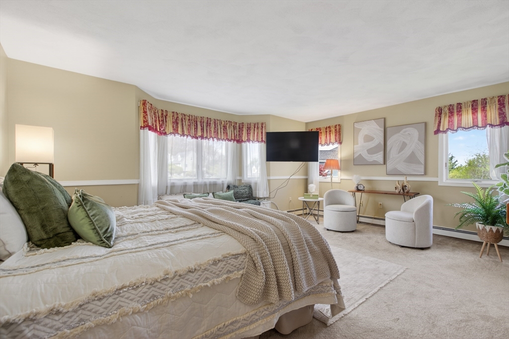 43 Hampshire Road Peabody, MA 01960 - Photo 25 of 42 a bedroom with a large bed and a large window